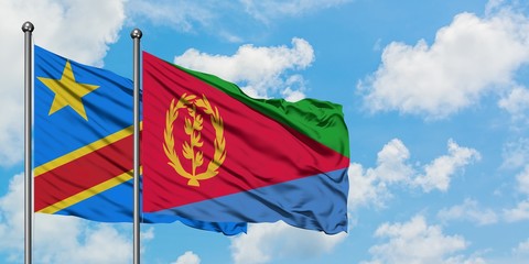 Congo and Eritrea flag waving in the wind against white cloudy blue sky together. Diplomacy concept, international relations.