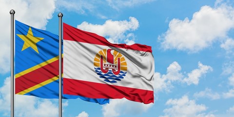 Congo and French Polynesia flag waving in the wind against white cloudy blue sky together. Diplomacy concept, international relations.