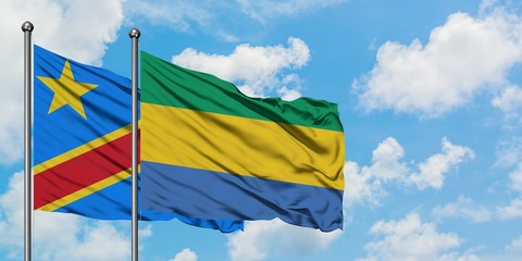 Congo and Gabon flag waving in the wind against white cloudy blue sky together. Diplomacy concept, international relations.