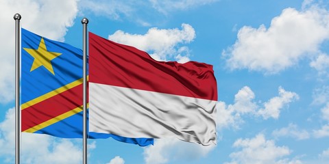 Congo and Indonesia flag waving in the wind against white cloudy blue sky together. Diplomacy concept, international relations.