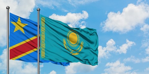 Congo and Kazakhstan flag waving in the wind against white cloudy blue sky together. Diplomacy concept, international relations.