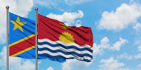 Congo and Kiribati flag waving in the wind against white cloudy blue sky together. Diplomacy concept, international relations.