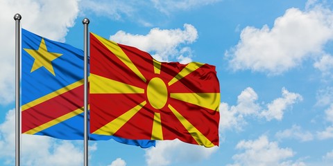 Congo and Macedonia flag waving in the wind against white cloudy blue sky together. Diplomacy concept, international relations.