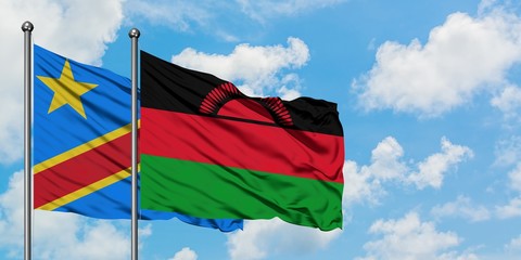 Congo and Malawi flag waving in the wind against white cloudy blue sky together. Diplomacy concept, international relations.