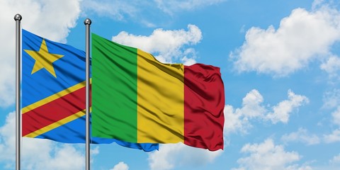 Congo and Mali flag waving in the wind against white cloudy blue sky together. Diplomacy concept, international relations.