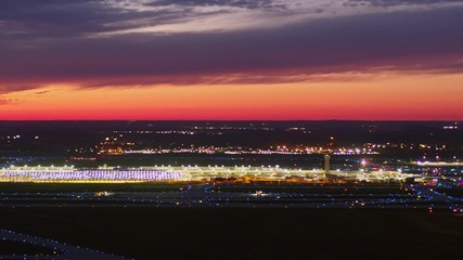 Detroit Michigan Aerial v173 Panning sunset dusk airport cityscape to birdseye looking over field and hangar - October 2017