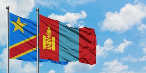 Congo and Mongolia flag waving in the wind against white cloudy blue sky together. Diplomacy concept, international relations.