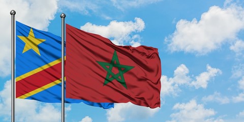 Congo and Morocco flag waving in the wind against white cloudy blue sky together. Diplomacy concept, international relations.