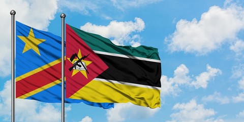 Congo and Mozambique flag waving in the wind against white cloudy blue sky together. Diplomacy concept, international relations.