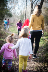 family and children walking in the park