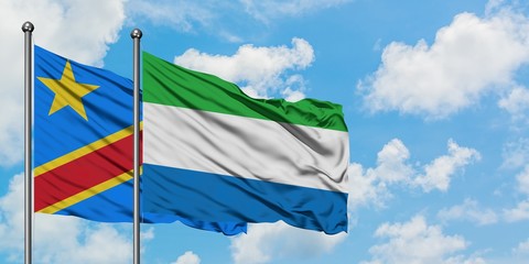 Congo and Sierra Leone flag waving in the wind against white cloudy blue sky together. Diplomacy concept, international relations.