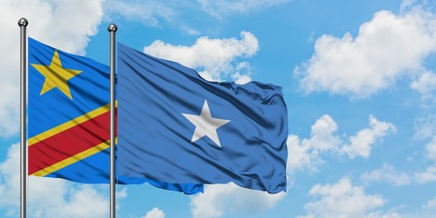 Congo and Somalia flag waving in the wind against white cloudy blue sky together. Diplomacy concept, international relations.