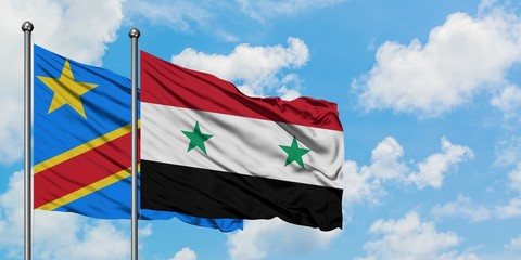 Congo and Syria flag waving in the wind against white cloudy blue sky together. Diplomacy concept, international relations.