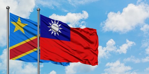 Congo and Taiwan flag waving in the wind against white cloudy blue sky together. Diplomacy concept, international relations.