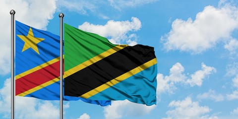 Congo and Tanzania flag waving in the wind against white cloudy blue sky together. Diplomacy concept, international relations.