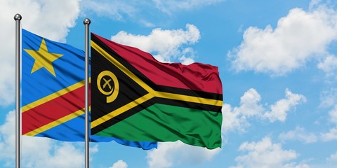 Congo and Vanuatu flag waving in the wind against white cloudy blue sky together. Diplomacy concept, international relations.