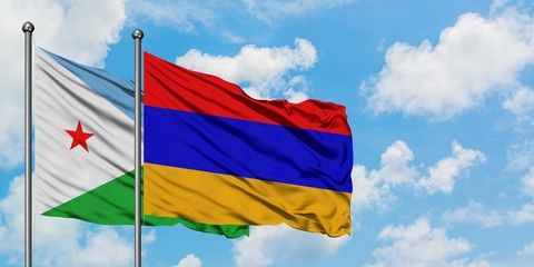 Djibouti and Armenia flag waving in the wind against white cloudy blue sky together. Diplomacy concept, international relations.
