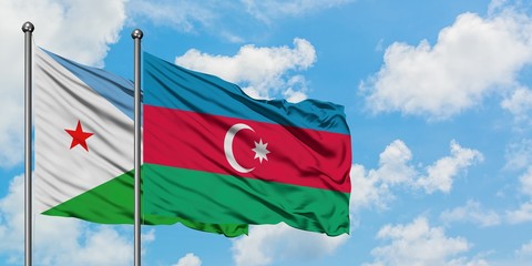 Djibouti and Azerbaijan flag waving in the wind against white cloudy blue sky together. Diplomacy concept, international relations.