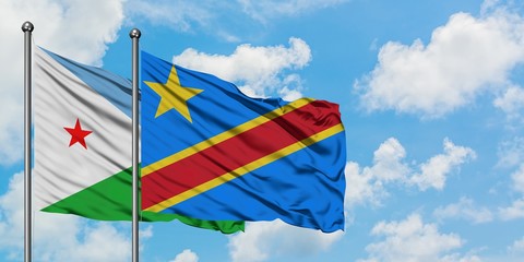 Djibouti and Congo flag waving in the wind against white cloudy blue sky together. Diplomacy concept, international relations.