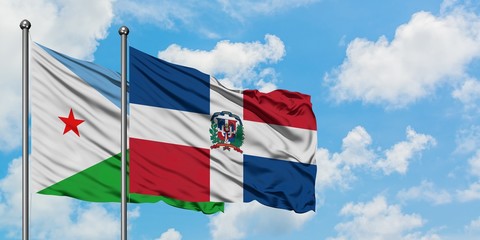 Djibouti and Dominican Republic flag waving in the wind against white cloudy blue sky together. Diplomacy concept, international relations.