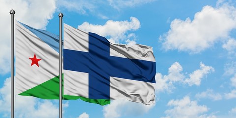 Djibouti and Finland flag waving in the wind against white cloudy blue sky together. Diplomacy concept, international relations.