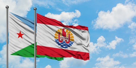 Djibouti and French Polynesia flag waving in the wind against white cloudy blue sky together. Diplomacy concept, international relations.