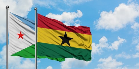 Djibouti and Ghana flag waving in the wind against white cloudy blue sky together. Diplomacy concept, international relations.