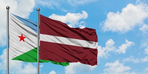 Djibouti and Latvia flag waving in the wind against white cloudy blue sky together. Diplomacy concept, international relations.