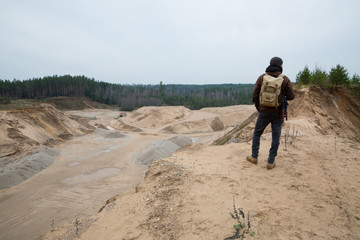 City of Cesis, Republic of Latvia. Sand quarry with excavated ditches and walking people. Travel photo. November 2019.