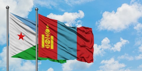 Djibouti and Mongolia flag waving in the wind against white cloudy blue sky together. Diplomacy concept, international relations.