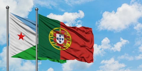 Djibouti and Portugal flag waving in the wind against white cloudy blue sky together. Diplomacy concept, international relations.