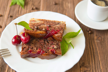 Chocolate pie with cherry on rustic table