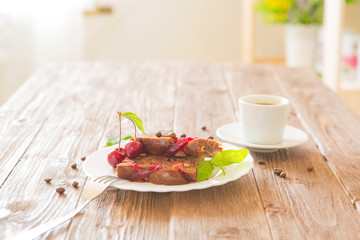 Chocolate pie with cherry on rustic table