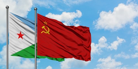Djibouti and Soviet Union flag waving in the wind against white cloudy blue sky together. Diplomacy concept, international relations.