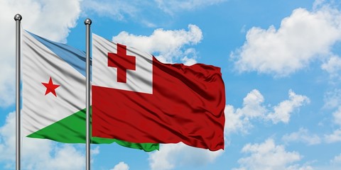 Djibouti and Tonga flag waving in the wind against white cloudy blue sky together. Diplomacy concept, international relations.
