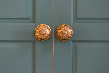 Classic retro brass door knob on green door vintage decoration retro interior style