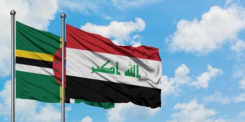 Dominica and Iraq flag waving in the wind against white cloudy blue sky together. Diplomacy concept, international relations.