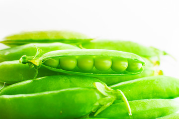 Green pods peas on a white background