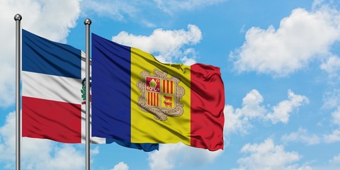 Dominican Republic and Andorra flag waving in the wind against white cloudy blue sky together. Diplomacy concept, international relations.