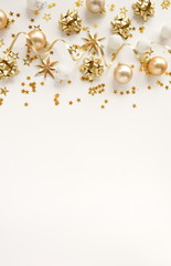 Fototapeta na wymiar Christmas background. Xmas or new year gold white decorations on white background top view. holiday and celebration concept for postcard or 