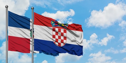 Dominican Republic and Croatia flag waving in the wind against white cloudy blue sky together. Diplomacy concept, international relations.