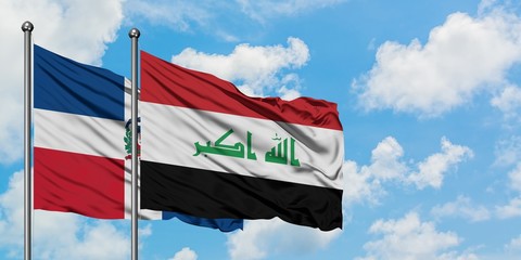 Dominican Republic and Iraq flag waving in the wind against white cloudy blue sky together. Diplomacy concept, international relations.