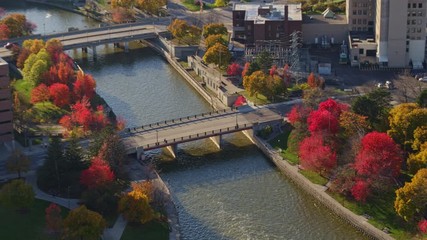 Flint Michigan Aerial v3 Panning birdseye detail near university buildings rotating to open cityscape - October 2017