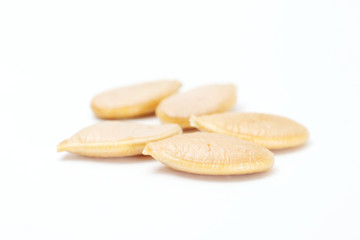 Processed Pumpkin seeds isolated on white background with clipping path