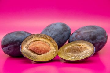 plums on a wooden background