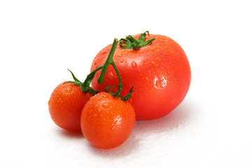 Delicious red tomato cherry on a white background.