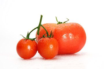 Delicious red tomato cherry on a white background.
