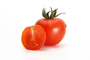 Delicious red tomato cherry on a white background.
