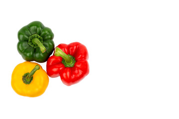 Green, red and yellow bell peppers on isolated backgrounds