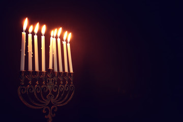 Religion image of jewish holiday Hanukkah background with menorah (traditional candelabra) and candles